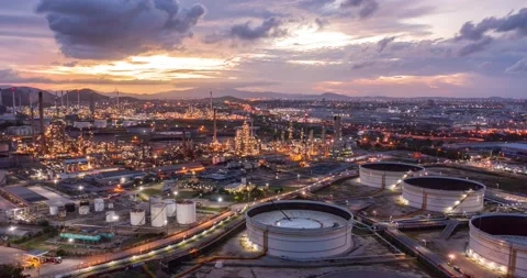 Aerial Hyperlapse Time-lapse of the refinery and oil tank at dusk. Business a Stock Footage 196597390