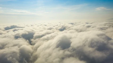 Aerial Hyperlapse Timelapse. Fly on the clouds with the morning sun Clouds move  Stock Footage 119137092
