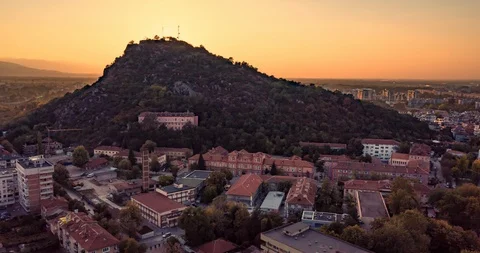 Aerial Hyperlapse Timeplapse Around Hill at Dusk Urban Landscape Technology Stock Footage 97702767