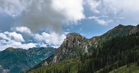 Aerial Hyperlapse of Val di Fassa Mountains in Italy With Dramatic Clouds Over Stock Footage 331577393