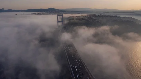 Aerial hyperlapse video of Fatih Sultan Mehmet Bridge on a foggy day in Istanbul Stock Footage 120054649