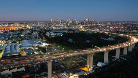 Aerial hyperlapse video of highway connected to Melbourne CBD at night Stock Footage
