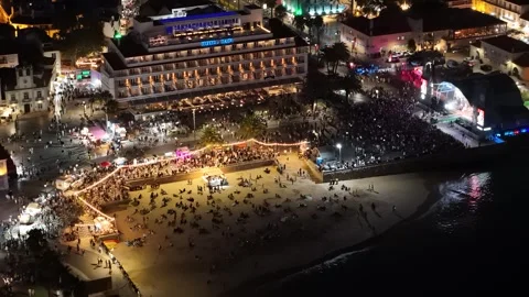 Aerial hyperlapse view of the bustling Festas do Mar concert in Cascais, Portuga Stock Footage 282626727