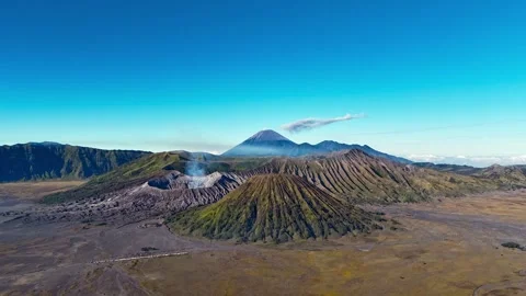 Aerial hyperlapse view of Mount Semeru erupting above Bromo caldera, East Java Stock Footage 315108398