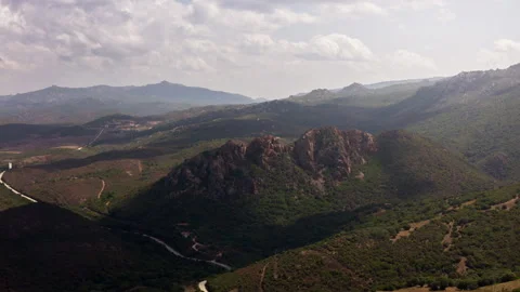 Aerial Hyperlapse View Rocky Mountains By Olive Tree Fields. Sardinia, Italy. Stock Footage 287883382
