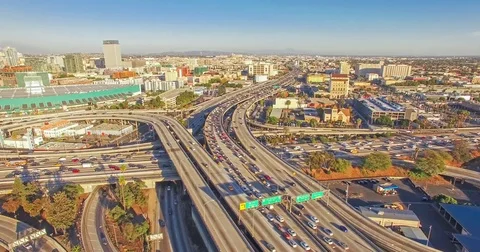 Aerial hyperlapse view shot flying over heavy traffic on a freeway Stock Footage 70609433