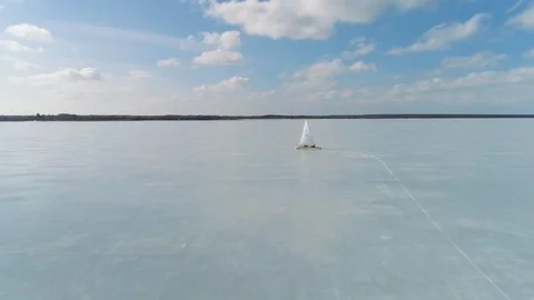 Aerial of an ice boat performing a tacking maneuver (Monotype-XV class) Stock Footage 88201588