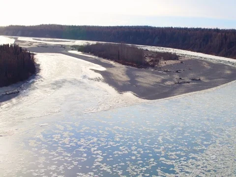 Aerial of ice floating on the river surface and coniferous trees along the coast 스톡 동영상 79656789
