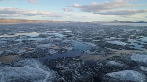 Aerial ice floes icebergs float lake Baikal Siberia epic spring nature. Climate Stock Footage 202642408