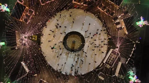 Aerial ice rink hover over people Video stock 323614718
