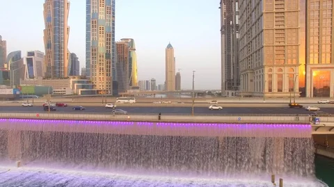Aerial. Illuminated Waterfall at the Sheikh Zayed Bridge. Dubai Water Canal. 4K Video stock 80302578