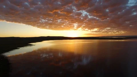Aerial Incredible Clouds Sunset Over Lake in Wyoming Stock Footage 101622047