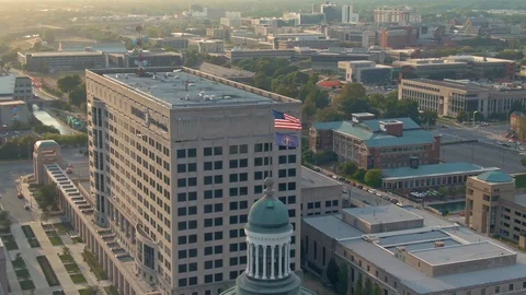 Aerial: Indiana Statehouse flag, Indianapolis at night, Indiana, USA Stock Footage
