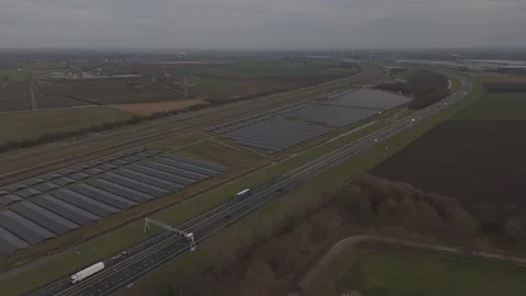 Aerial infrastructure view of solar farm near highway and railway Видео 330189902