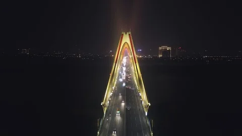 Aerial inside cable Nhat Tan bridge Asia Between pylons Road traffic Night Light Stock Footage 107138745