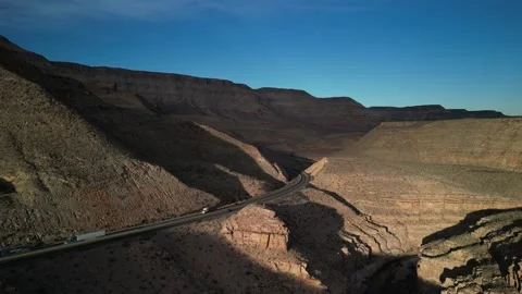 Aerial of Interstate 15 through Virgin River Canyon in northern Arizona desert Stock Footage 302330270