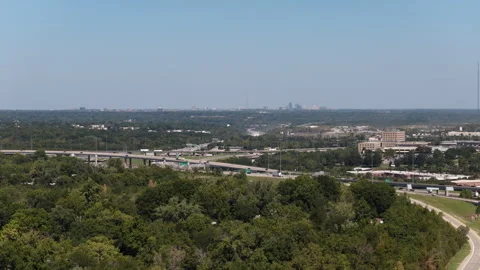 Aerial of interstate 470 interchange and wooden urban areas in Kansas City Stock Footage 344810555