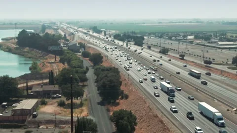 Aerial: Interstate 5 freeway traffic in the central valley, Stockton Video stock 156436391