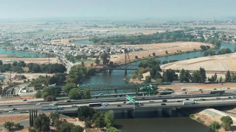Aerial: Interstate 5 freeway traffic crossing the San Joaquin River, Stockton Stock Footage 156461524