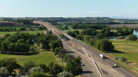 Aerial of Interstate 84 over Snake River in Ontario Oregon rural area in spring Stock Footage 335779688