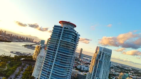 Aerial inversion spin Miami at sunset. View of highrise towers port miami a.. Stock Footage 319453472