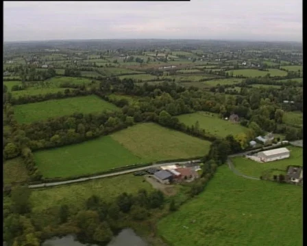 Aerial of Irish countryside to village Stock Footage
