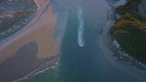 Aerial of a Jet ski navigating the harbor entrance Video stock 190627155