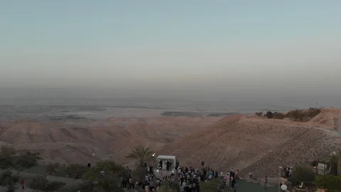 Aerial Jewish wedding  Chuppah in desert view to valley of Dead Sea Stock Footage