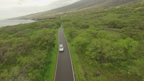 Aerial Jib Down White Van Driving Secluded Oceanside Road. Stock-Footage 95919892