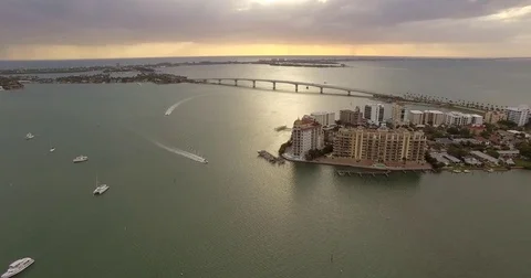 Aerial John Ringling Bridge at Sunset with Condos, Boats, and Cars in Sarasota Vídeos de archivo 74736676