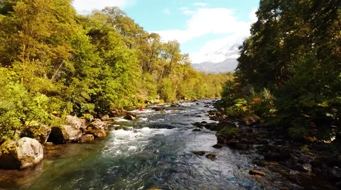 Aerial: Kayakers Going Down Stream Low Tracking Shot On Patagonia Chile River 2K Stock Footage 64673308