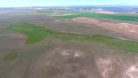 Aerial Kazakhstan farmland patchwork fields hills cultivated plains rural Stock-Footage 333831939