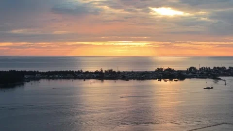 Aerial of lagoon sunset with fishing structures Hue 4K Stock Footage 339864641