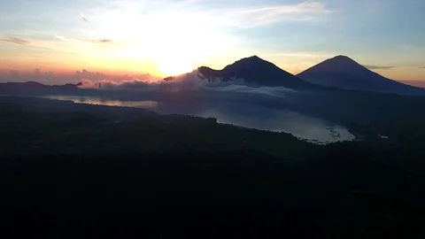 Aerial of lake mountain and cloudscape at sunset Stock Footage 81448528