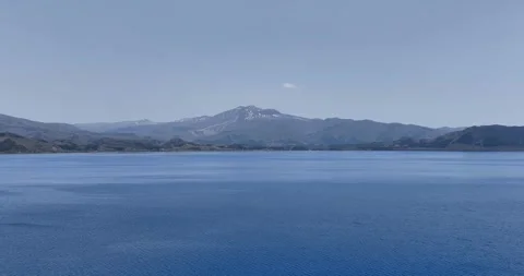 Aerial - Lake Tazawa in the direction of Mount Akita Komagatake, ascending. Stock Footage 297123738