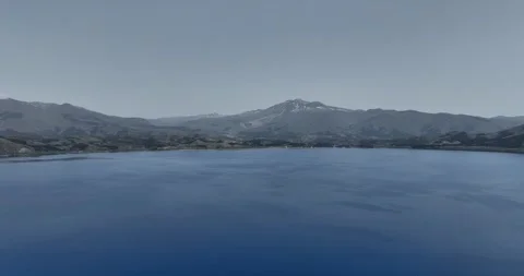 Aerial - Lake Tazawa in the direction of Mount Akita Komagatake, Pan right. Stock Footage 297123782