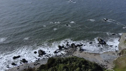 Aerial of Land's end with waves crashing onto shore, 4K Stock Footage 106955089