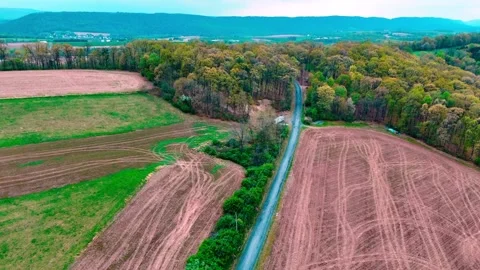 Aerial landscape of corn fields farmland mountains sunset rural Appalachia .. 動画素材 318655389