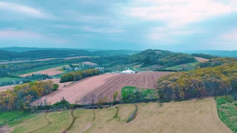 Aerial landscape of corn fields farmland mountains sunset rural Appalachia .. Видео 318664397