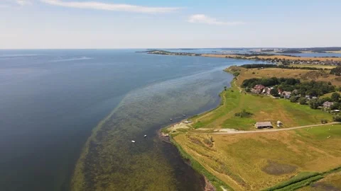 Aerial landscape of fields and the Baltic Sea in Mnchgut Rgen Germany Video stock 250085481
