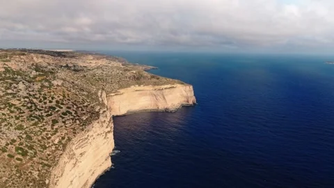 Aerial landscape high angle wide drone shot flying towards the dingli cliffs Stock Footage 336431704