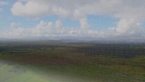 Aerial landscape holding steady while cloud shadow entering left, sweeping Stock Footage 333397195