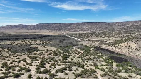 Aerial landscape of lava fields and Western cliffs along historic route 66 .. 스톡 동영상 320738888