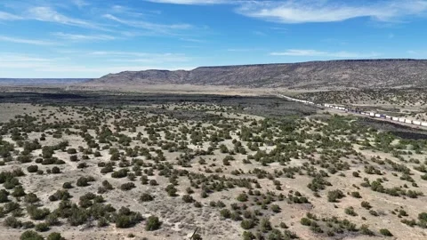 Aerial landscape of lava fields and Western cliffs along historic route 66 .. 스톡 동영상 320738891
