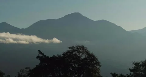 Aerial Landscape of Mountain Range and Valley in Soft Morning Fog Indonesia 動画素材 331702377
