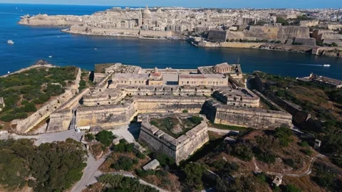 Aerial landscape static high angle drone shot of fort Manoel in Malta at summer Stock Footage 335292667