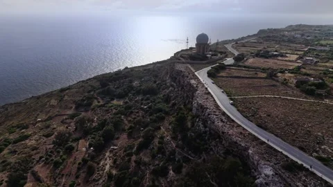 Aerial landscape wide angle drone shot flying away over the dingli cliffs and Stock Footage 336431839