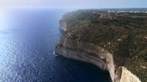 Aerial landscape wide high angle drone shot slow panning right over the dingli Stock Footage 336431858