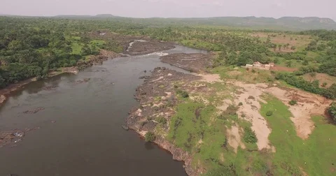 Aerial large river between rocks and green area in guinea conakry africa Stock-Footage 82399077