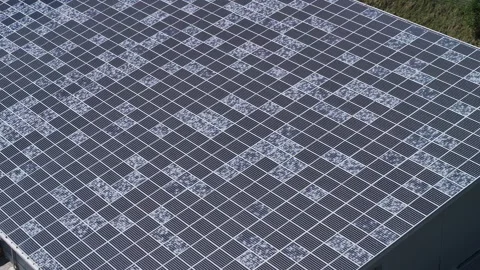 AERIAL: Large solar panel farm covered in a distinct pattern of shattered glass Stock Footage 319379798